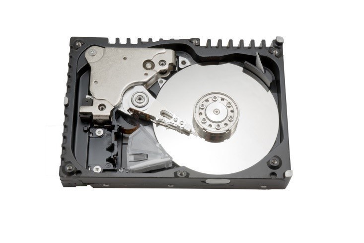 The inside of an old-fashioned hard drive